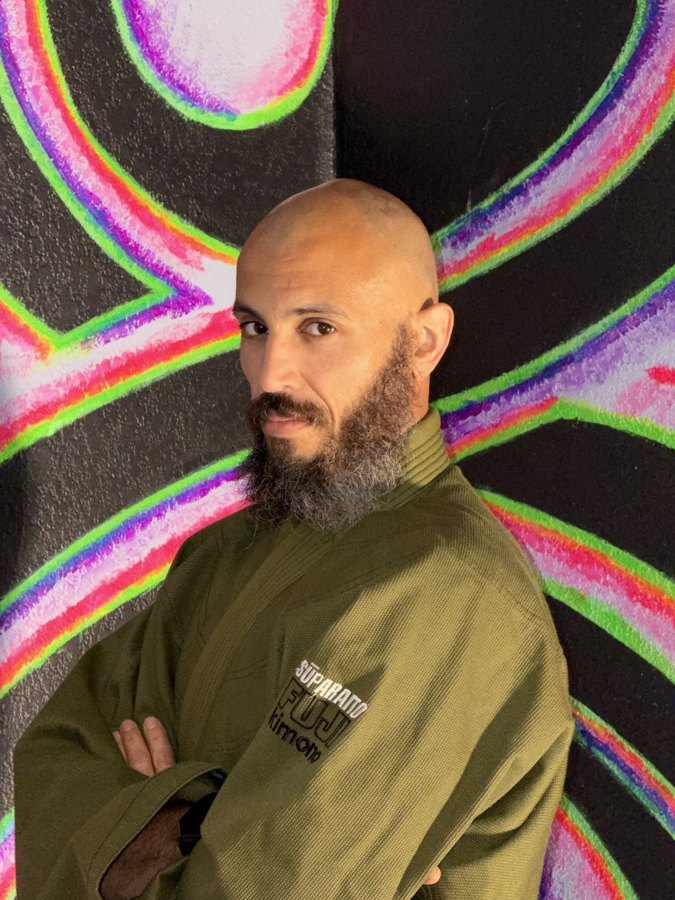 Instructor in an olive gi
